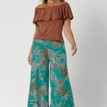 These Leina & Fleur Dany Pants are a highly sought-after style that combines comfort, versatility, and a flattering fit for all heights. Part of the jade safari print collection, these pants are crafted from a slinky jersey fabric that offers a soft, full-body stretch, providing a smooth, flattering silhouette and all-day comfort. Available in size 8-24.
