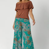 These Leina & Fleur Dany Pants are a highly sought-after style that combines comfort, versatility, and a flattering fit for all heights. Part of the jade safari print collection, these pants are crafted from a slinky jersey fabric that offers a soft, full-body stretch, providing a smooth, flattering silhouette and all-day comfort. Available in size 8-24.