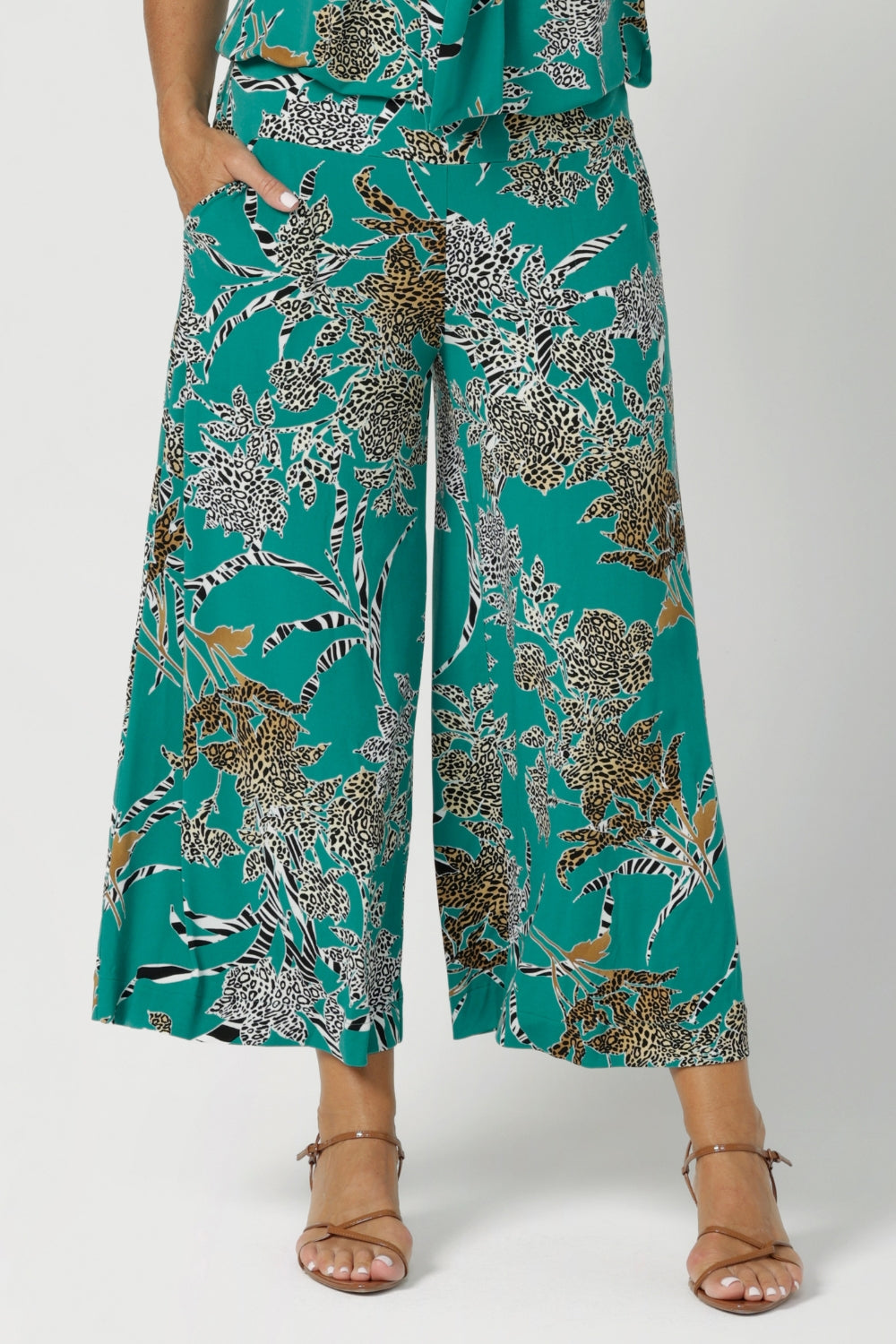 Dany Pants are a highly sought-after style that combines comfort, versatility, and a flattering fit for all heights. Part of the jade safari print collection, these pants are crafted from a slinky jersey fabric that offers a soft, full-body stretch, providing a smooth, flattering silhouette and all-day comfort. Available in size 8-24.