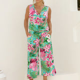 40 year old woman wears Joni top in Malibu matched with printed Dany Culotte in Malibu, creating a faux jumpsuit styled look. The matching set provide a polished yet effortless look ready for the summer event season. Made of easy care slinky fabric, these garments are an amazing travel essential with their wrinkle resistant qualities. Stocked in sizes 8-24, there is a size for everyone at Leina & Fleur.