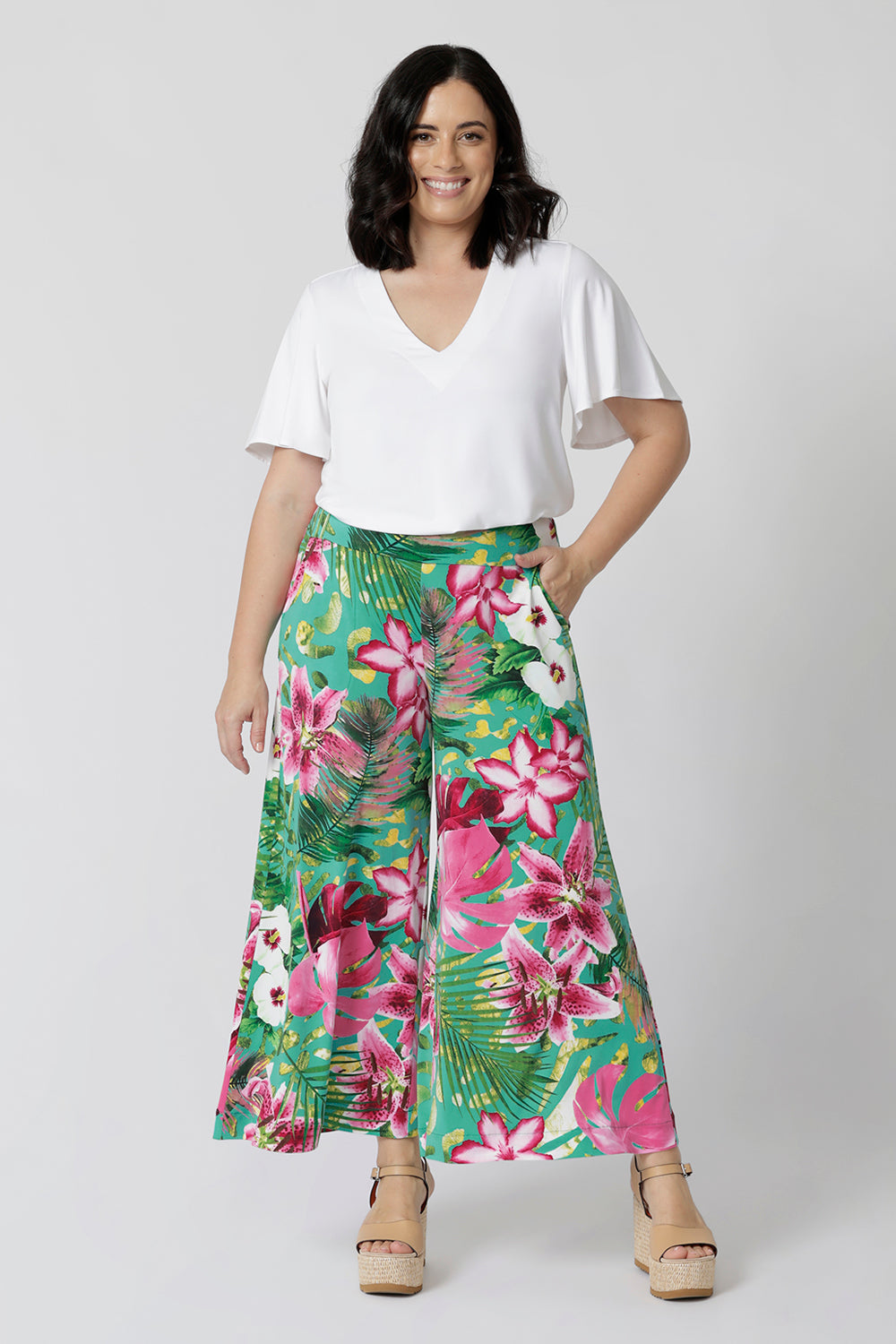 These printed floral culottes are the perfect combination of comfort and style, designed with petite heights in mind. Featuring a flattering flared pant silhouette, they offer a relaxed, yet chic fit that elongates the legs and moves effortlessly with you. The pull-on style ensures ease of wear, while the slinky jersey fabric drapes beautifully, offering a soft, fluid feel against the skin.