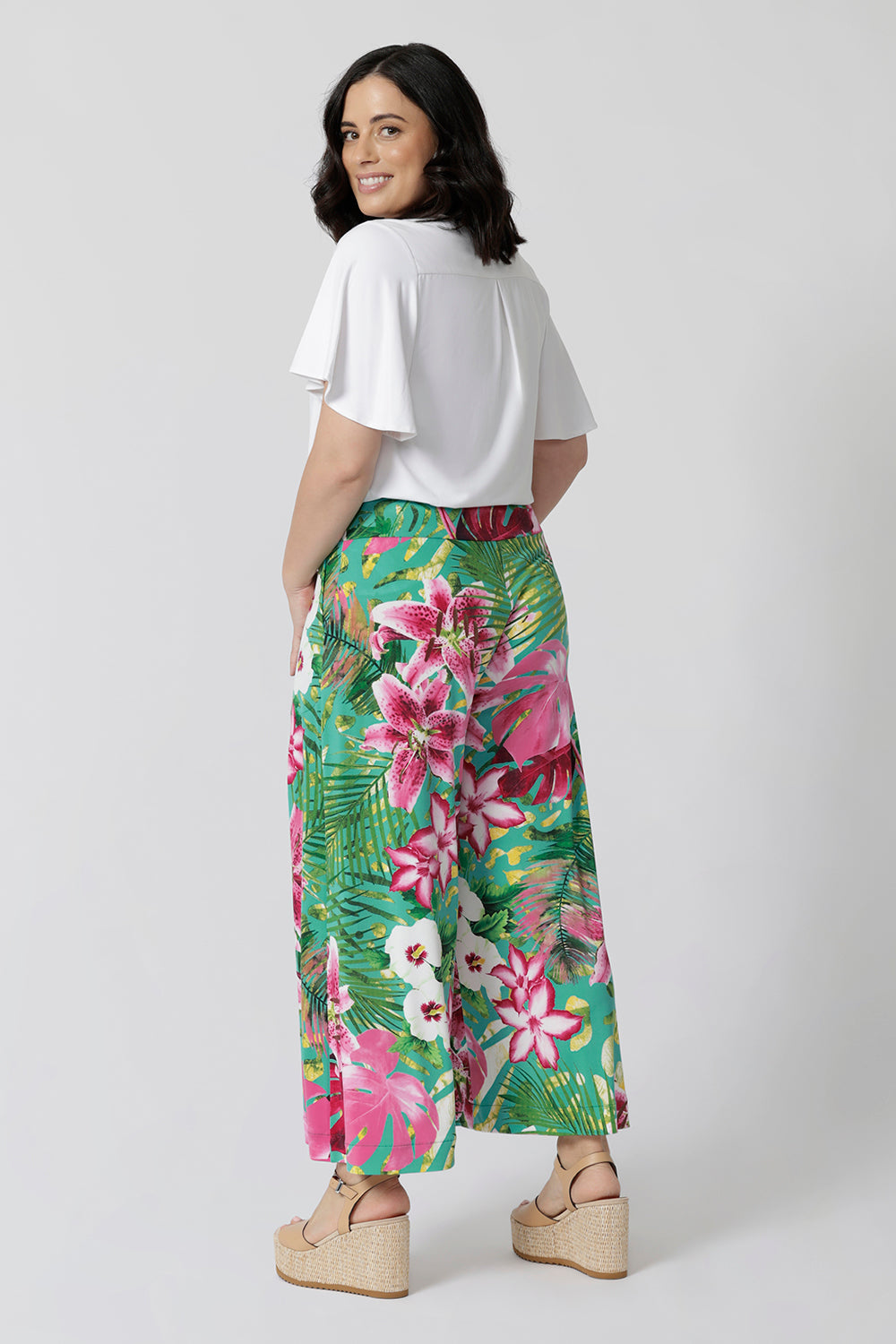 Ideal for summer events, these culottes are also wrinkle-resistant. With a vibrant floral print, they bring a touch of tropical elegance to any occasion. Made in Australia, they combine high-quality craftsmanship with a laid-back, sophisticated design that's perfect for sunny days. Whether you're attending a garden party or enjoying a resort getaway, these culottes are a go-to for effortless, chic style.