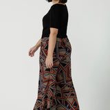 Back view of a size 10 woman wearing the Dany Culotte in Trixie, a printed Jersey work pant with a geometric pattern. Wide leg with functional pockets and wide waistband. Cropped length and petite height friendly. Made in Australia for women size 8 - 24.