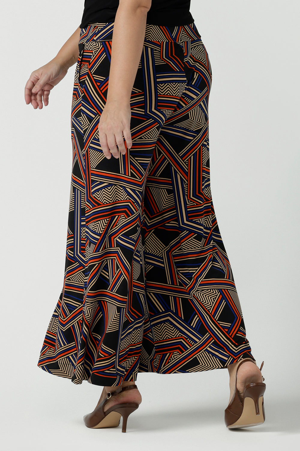 Back view of a size 10 woman wearing the Dany Culotte in Trixie, a printed Jersey work pant with a geometric pattern. Wide leg with functional pockets and wide waistband. Cropped length and petite height friendly. Made in Australia for women size 8 - 24.