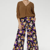 Designed with a double-layer pull-on waistband and functional side pockets with chic visible stitching, the Dany Culotte blends fashion and function seamlessly. Size 10 model wears her culottes with woven blouse tucked in and brown boots. 