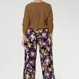 Designed with a double-layer pull-on waistband and functional side pockets with chic visible stitching, the Dany Culotte blends fashion and function seamlessly. Size 10 model wears her culottes with woven blouse tucked in and brown boots. 