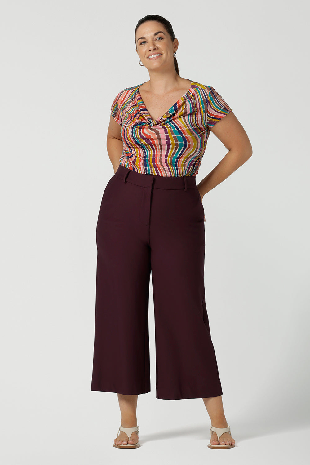 Curvy size 12 woman wears a cowl neck Daryl top in Kaleidoscope and Mulberry Yael pant. Work to weekend wear for women size 8 to 24.