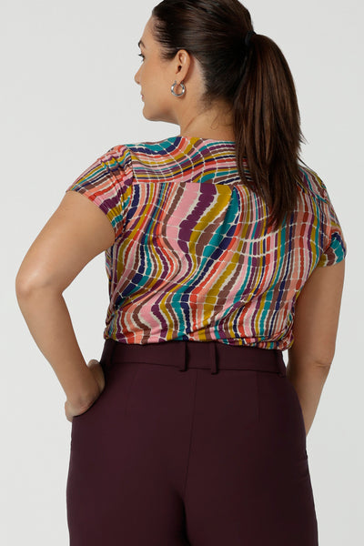 Back view of curvy size 12 woman wears a cowl neck Daryl top in Kaleidoscope and Mulberry Yael pant. Work to weekend wear for women size 8 to 24.