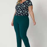 A good workwear pant for plus size women, this green tapered leg pant is shown on a size 18 woman. Worn with a cowl neck, short sleeve top in printed jersey, these ankle length pants wear for work and casual wear. Trousers with stretch, Australia and New Zealand women's clothes brand Leina & Fleur specialise in comfortable workwear for women in sizes 8 to 24.