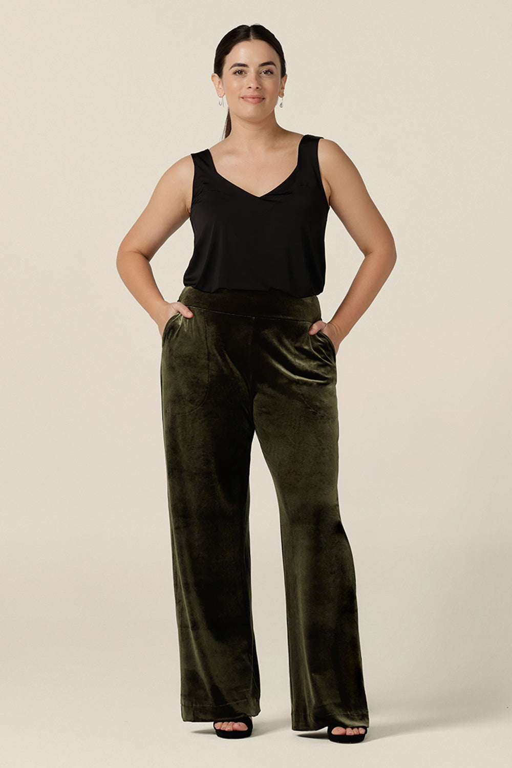 Good cocktail pants for women, the Deni Pants are straight, wide leg pants in green velour and are shown with a black cami top. These evening trousers are pull on pants and comfortable in stretch fabric. Shop this occasion and cocktail attire online at Australian fashion brand, Leina & Fleur.