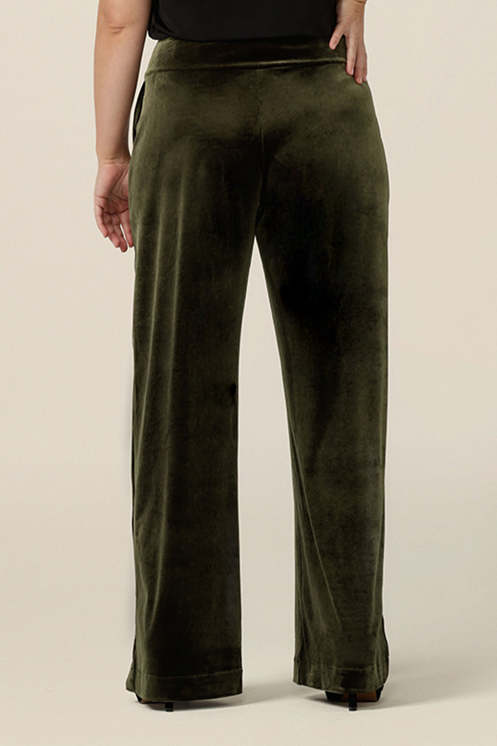 Back view of good cocktail pants for women, the Deni Pants are straight, wide leg pants in green velour. These velvet evening trousers are pull on pants and comfortable in stretch fabric. Shop this occasion and cocktail attire online at Australian fashion brand, Leina & Fleur.