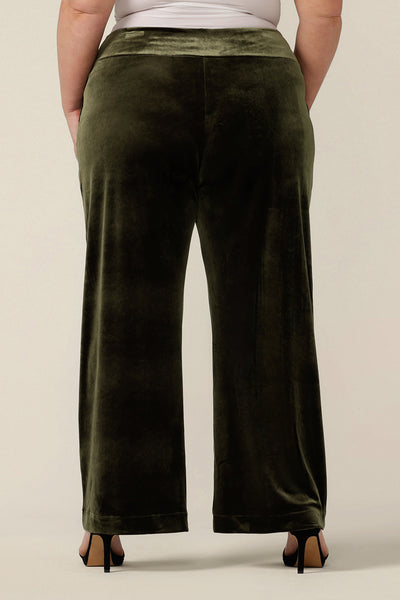 Back view of good cocktail pants for women, the Deni Pants are straight, wide leg pants in green velour. These velvet evening trousers are pull on pants and comfortable in stretch fabric. Shop petite to plus size occasion and cocktail attire online at Australian fashion brand, Leina & Fleur.