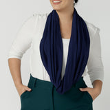 Woman wears bamboo fibre desiree scarf in french navy. Comfortable and heat regulating bamboo. Made in Australia style for women size 8 - 24.