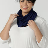 Woman wears bamboo fibre desiree scarf in french navy. Comfortable and heat regulating bamboo. Made in Australia style for women size 8 - 24.