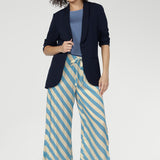 Functional side pockets add everyday practicality, while subtle hem slits enhance movement and flow. Pair back with Merit Blazer for a polished look