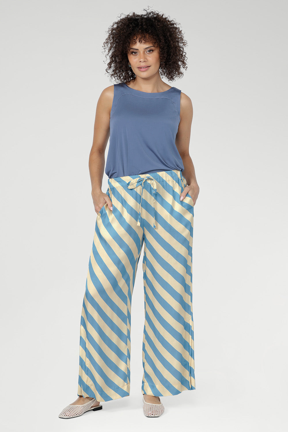 Crafted from breathable Italian viscose, the Devin Drawstring Pant is a lightweight summer staple designed for effortless comfort and relaxed elegance.