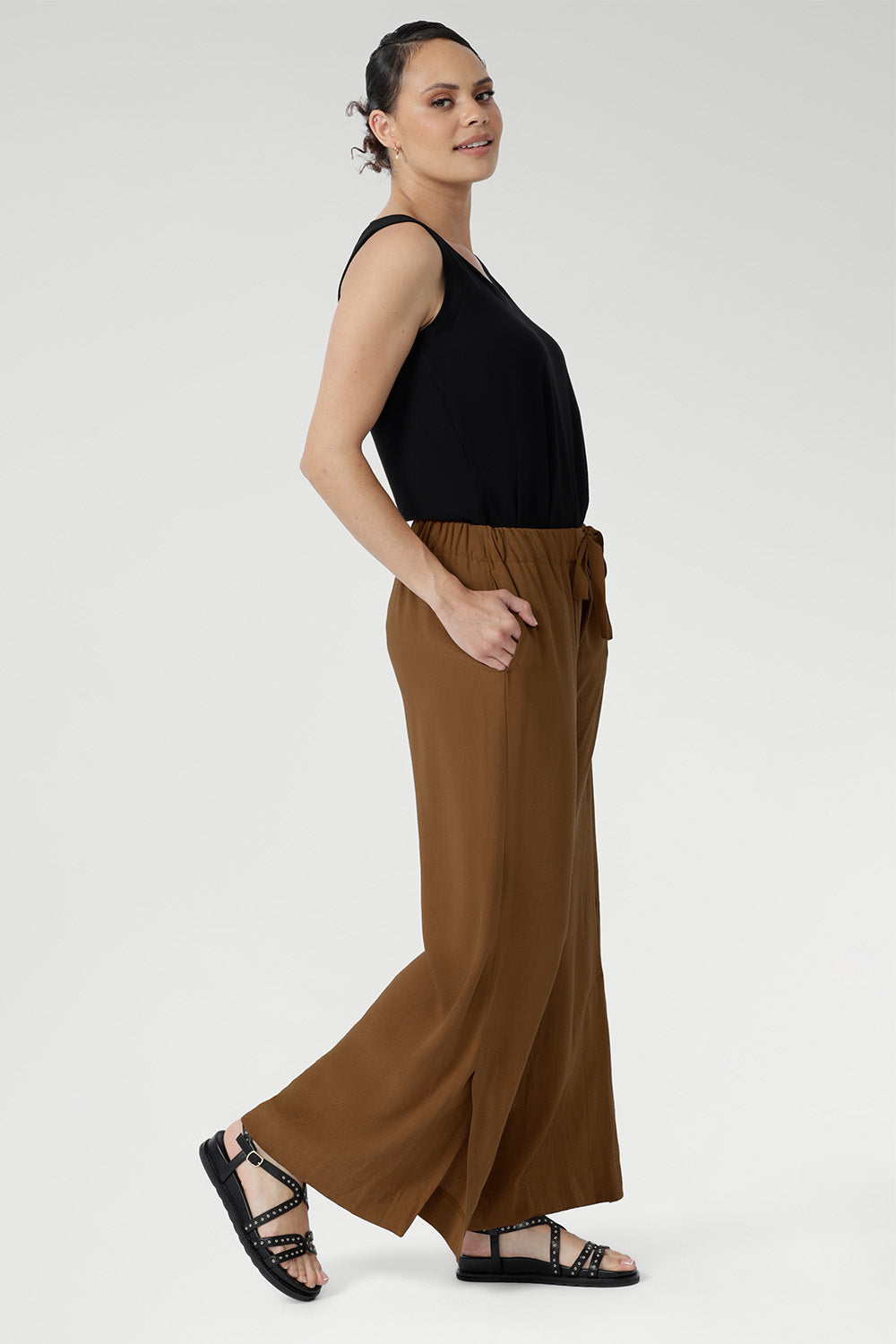 Side pockets offer practicality, while subtle hem slits add a hint of movement. Pair these lightweight pants with a simple tank or crisp shirt for effortless summer style. Made in Australia with integrity.