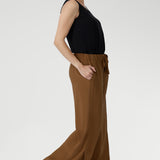 Side pockets offer practicality, while subtle hem slits add a hint of movement. Pair these lightweight pants with a simple tank or crisp shirt for effortless summer style. Made in Australia with integrity.