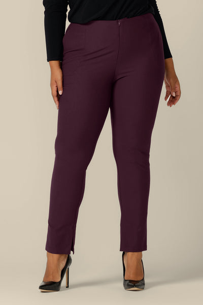 A size 18, fuller figure woman wears slim leg pants in mulberry ponte jersey by Australia and New Zealand women's clothing brand, L&F. Good pants for work, these Australian-made trousers fit an inclusive size range of sizes 8 to 24.