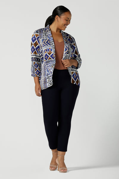Curvy woman in a size 16 wears a soft tailored blazer in Italian Viscose fabric. A beautiful digital print tile design. Styled back with slim fit Brooklyn pants in Navy with a Eddy Cami top Clay. A comfortable desk to dinner look. Made in Australia for women size 8 - 24.