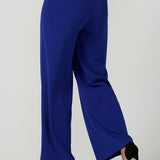 Back view of the Drew Pant in Cobalt Scuba Crepe with a wide leg Cobalt pant with a high waist that can be worn with the matching Blazer. Comfortable and easy care suit set for women. Size 8-24.