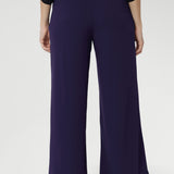 These pants create an effortlessly polished look that elevates any outfit.  Featuring practical angled front pockets, back darts for a flattering fit, and a discreet invisible front zip with an internal button, the Drew Pant balances style and functionality with ease. 