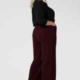 The pants feature straight-cut, wide legs for a modern, relaxed fit that flows beautifully from the waist down, offering a full-length look. Available in sizes 8-24, these pants are made by Leina & Fleur, a size-inclusive, Australian-made brand known for its high-quality craftsmanship and chic, versatile designs.