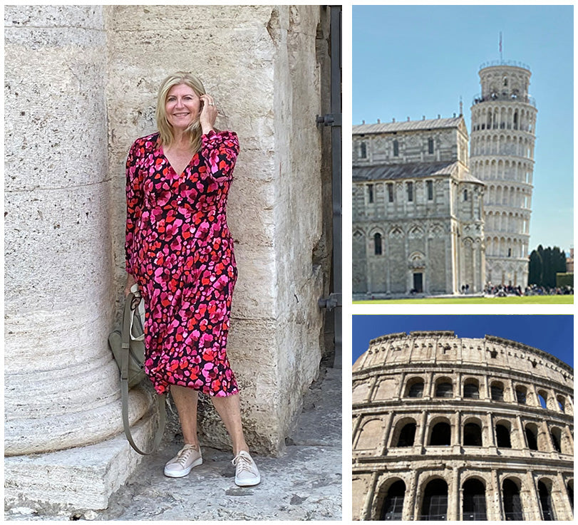 Image of an Australian woman wearing a long sleeve, jersey wrap dress in a red poppy floral print by Australian and New Zealand women's clothing label, L&F, as part of her guide to the ultimate capsule travel wardrobe. She is wearing L&Fs comfortable travel clothing sightseeing in Italy.