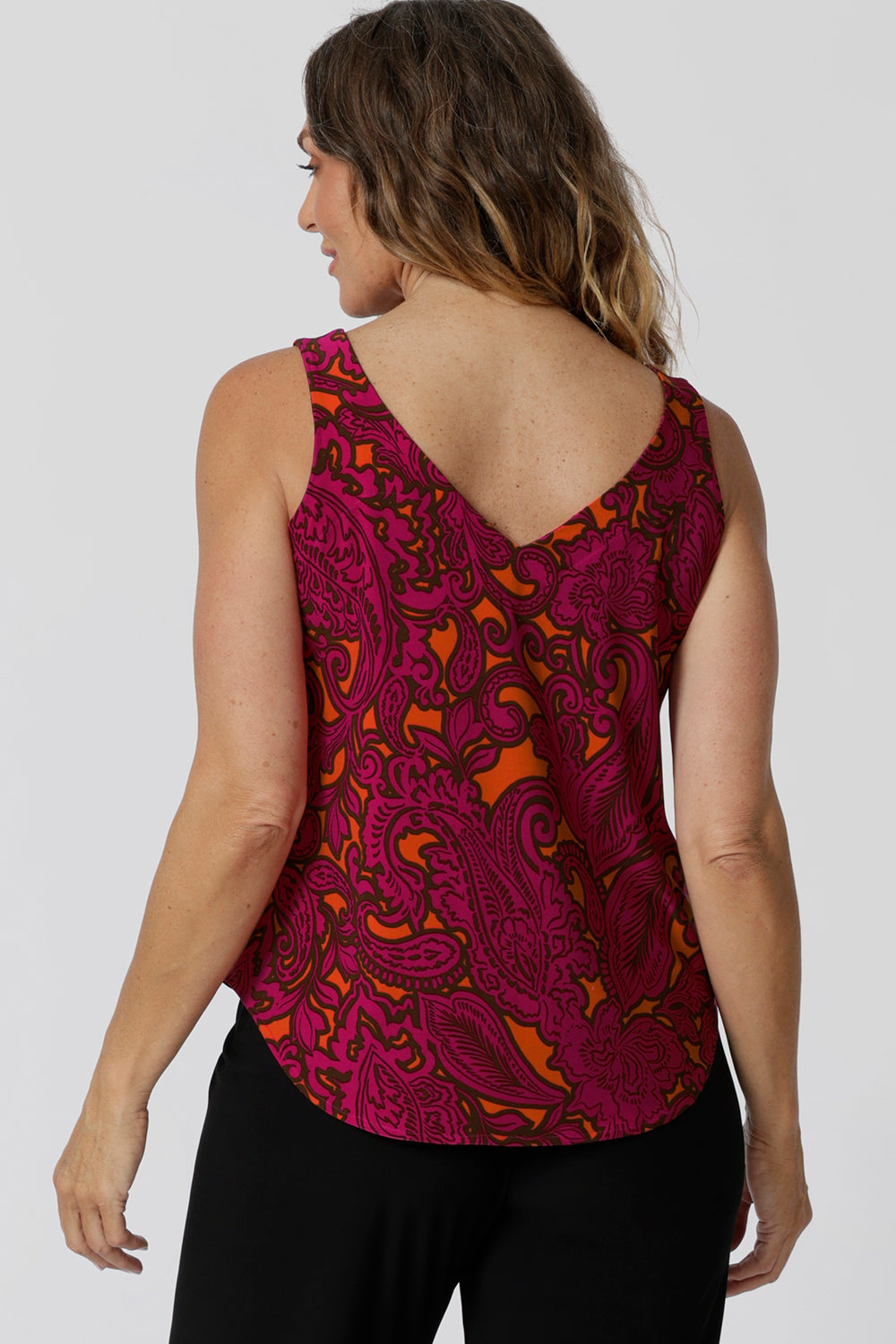 Back view of summer cami top shows v neck feature and wide shoulder straps to effortlessly conceal bra straps, making it a go-to piece for summer outings and layering. Leina & Fleur stock this top in sizes 8-24