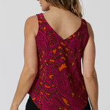 Back view of summer cami top shows v neck feature and wide shoulder straps to effortlessly conceal bra straps, making it a go-to piece for summer outings and layering. Leina & Fleur stock this top in sizes 8-24