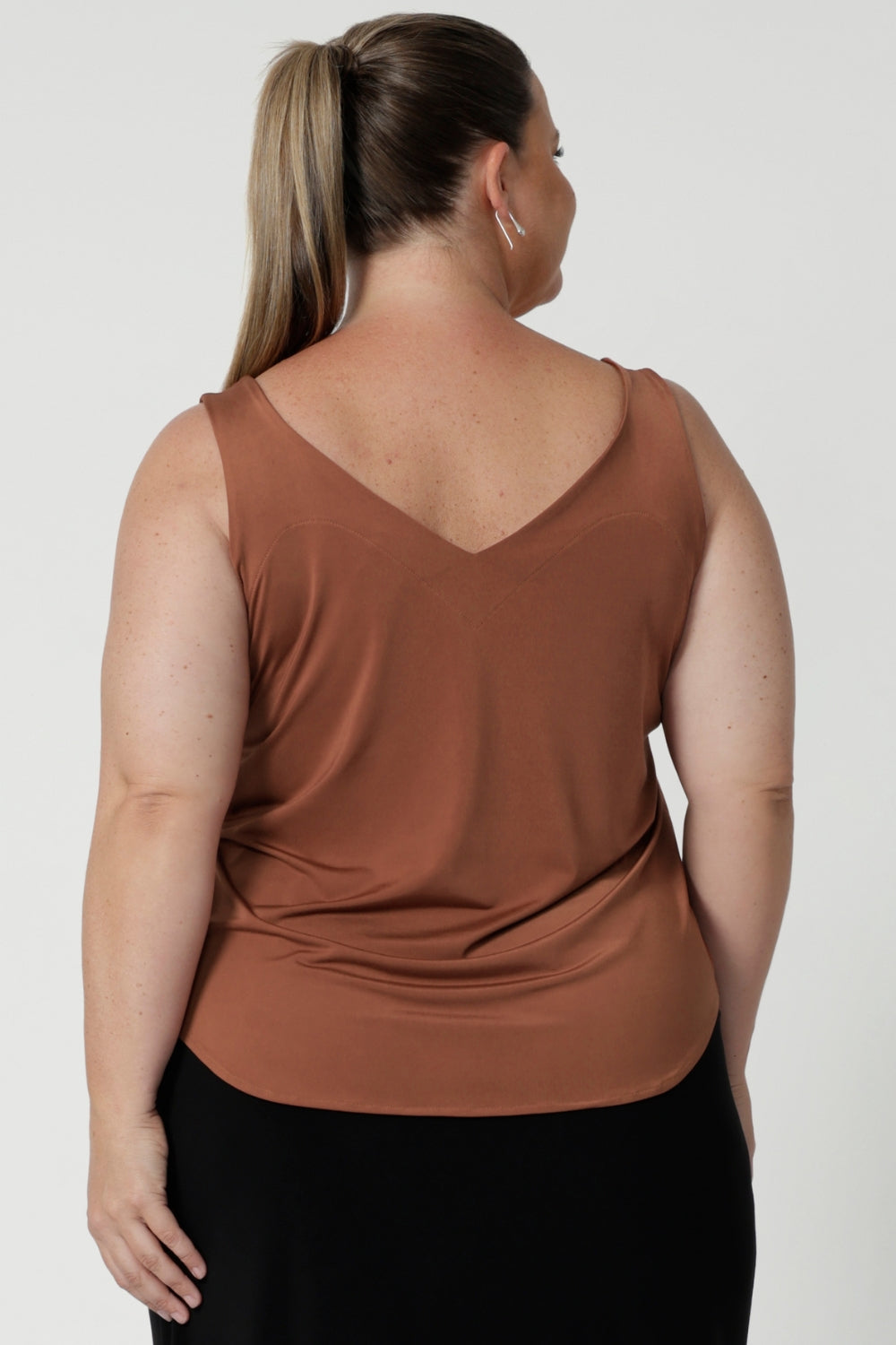 Summer ready cami top for off duty or event styling. Shown on size 18 woman. Eddy Cami in Clay in Clay has wider shoulder straps, a soft V-neckline and back line. Available in sizes 8-24.