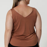 Summer ready cami top for off duty or event styling. Shown on size 18 woman. Eddy Cami in Clay in Clay has wider shoulder straps, a soft V-neckline and back line. Available in sizes 8-24.