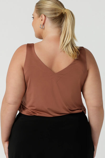 A great plus size cami top for casual weekend wear or event dressing. Eddy Cami in Clay has wide shoulder straps, a soft V-neckline and loose fitting slinky jersey body. Made in Australia by Australian fashion brand, Leina & Fleur.