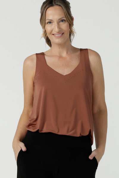 Close up of a cami top for casual weekend wear or event dressing. Eddy Cami in Clay has wide shoulder straps, a soft V-neckline and loose fitting slinky jersey body. Made in Australia by Australian fashion brand, Leina & Fleur.
