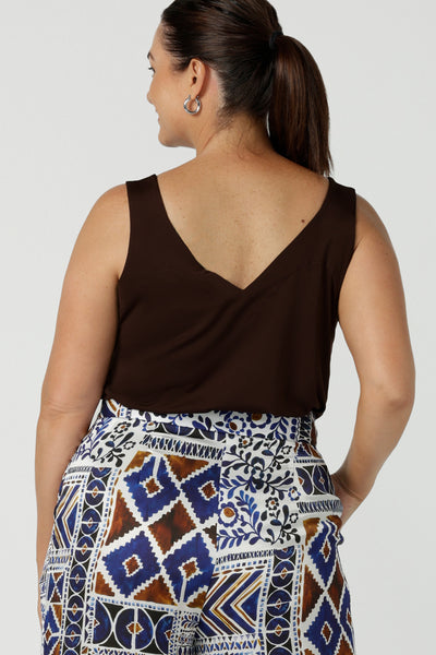 Back view of a size 12 woman wears the Eddy Cami in Cocoa a soft jersey cami style with wide straps for bra coverage. A comfortable work to weekend piece and great for layering back with a blazer. Styled back with the Ellery pants in Italian Viscose. Made in Australia for women size 8 to 24.