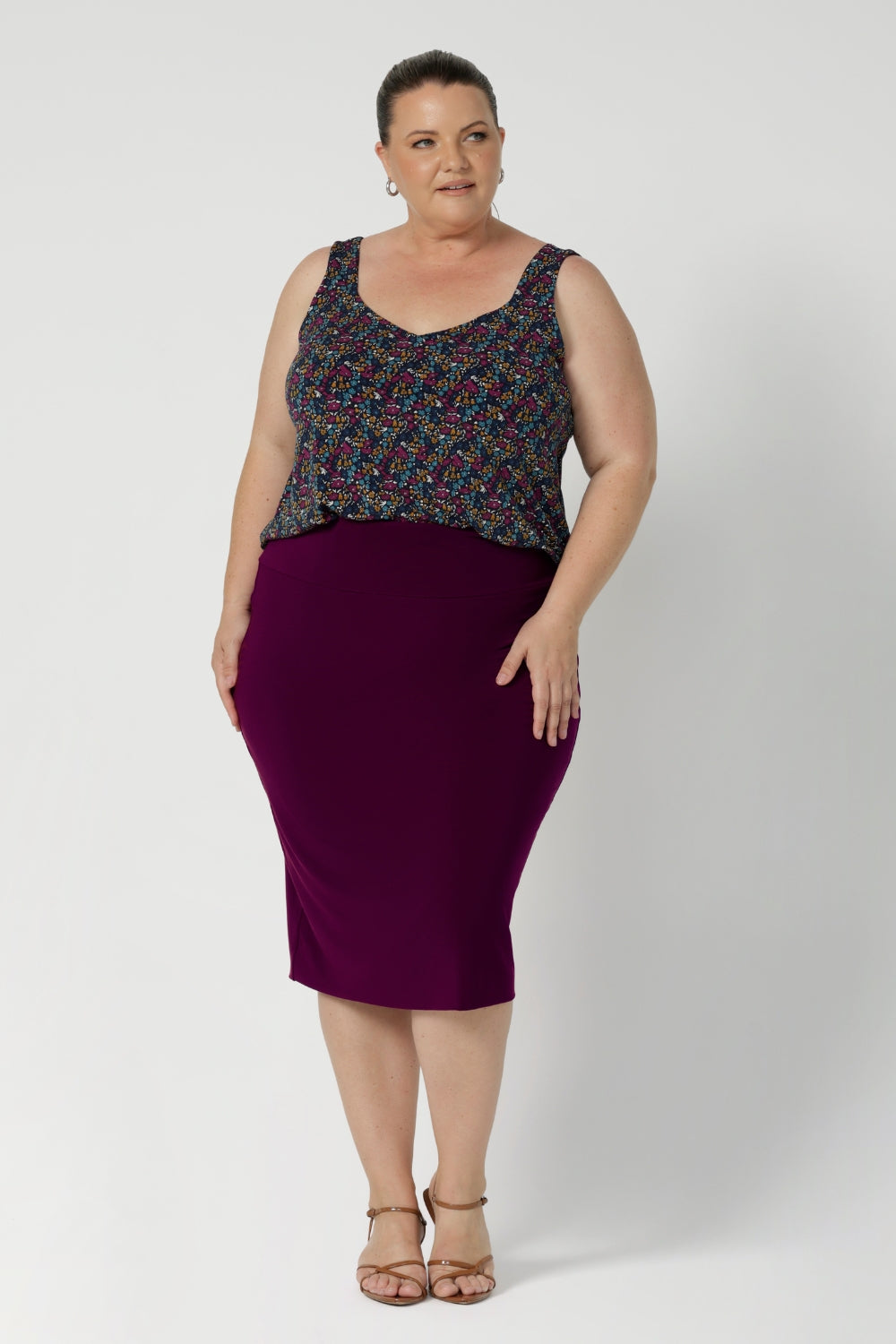 The cami is crafted in the stunning Harmony print, which features a navy dry-touch jersey base adorned with floral details in rich hues of magenta, mustard, blue, and vanilla. Available in sizes 8-24, this piece is an easy, stylish way to bring vibrant colour and a touch of floral charm to your summer wardrobe.