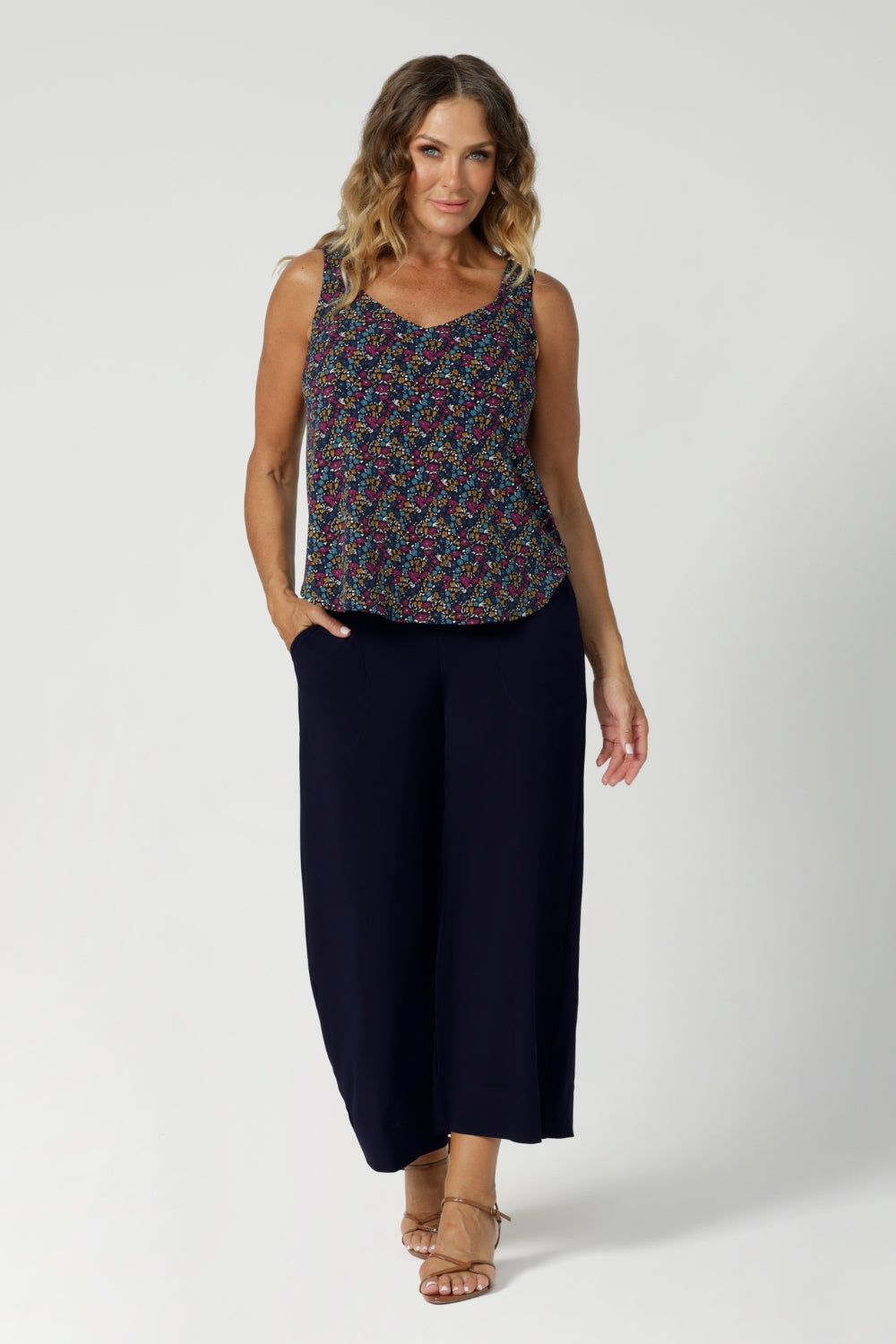 The cami is crafted in the stunning Harmony print, which features a navy dry-touch jersey base adorned with floral details in rich hues of magenta, mustard, blue, and vanilla. Available in sizes 8-24, this piece is an easy, stylish way to bring vibrant colour and a touch of floral charm to your summer wardrobe.