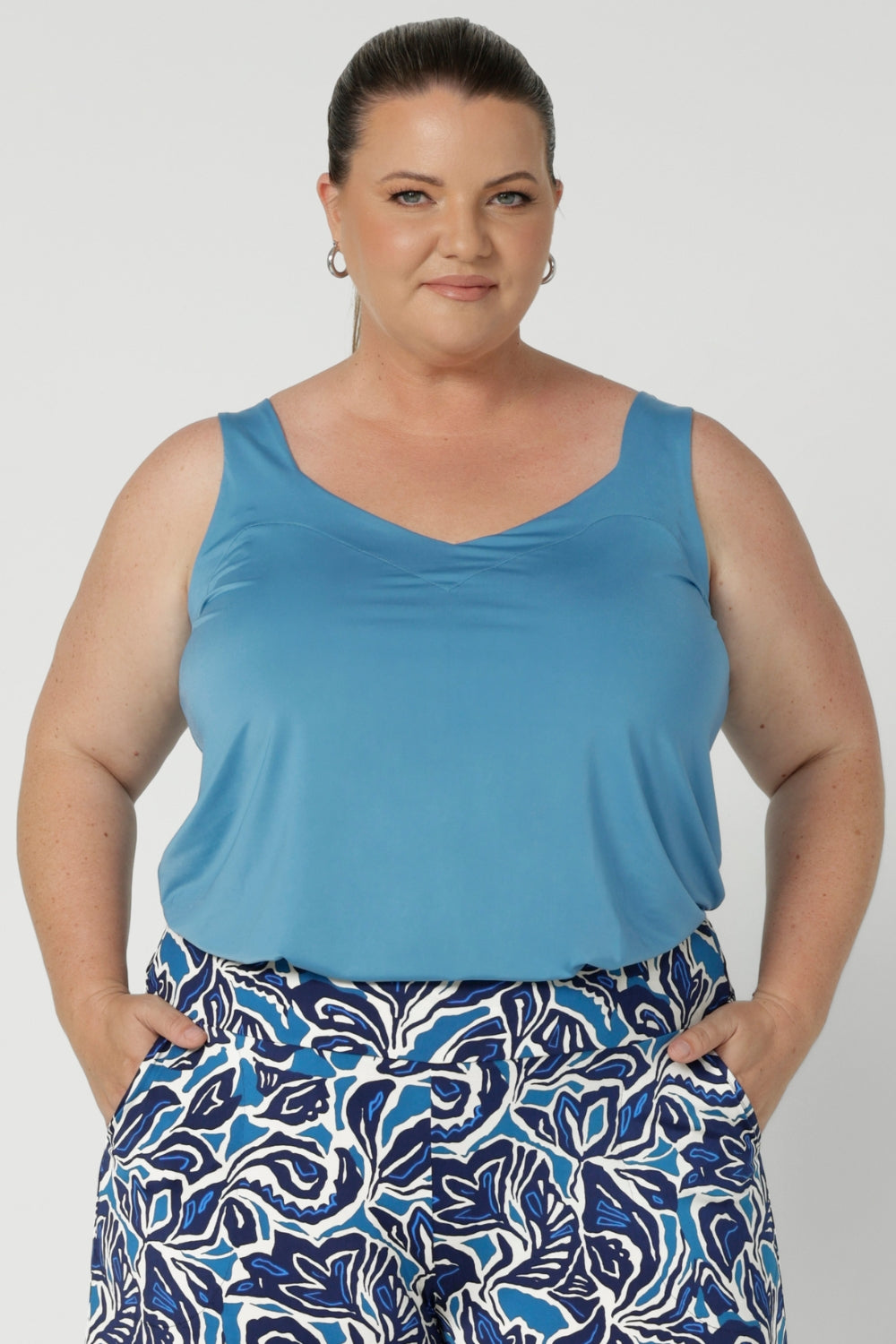 Size 18 woman wears the Eddy Cami top in Mineral is a curve friendly cami top with wide shoulder straps for bra strap coverage. Made in Australia for women size 8 - 24.