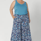 Over 40's woman wears the Eddy Cami top in Mineral. A curve friendly cami top with wide shoulder straps for bra strap coverage, paired with printed culotte pants. Made in Australia for women size 8 - 24.