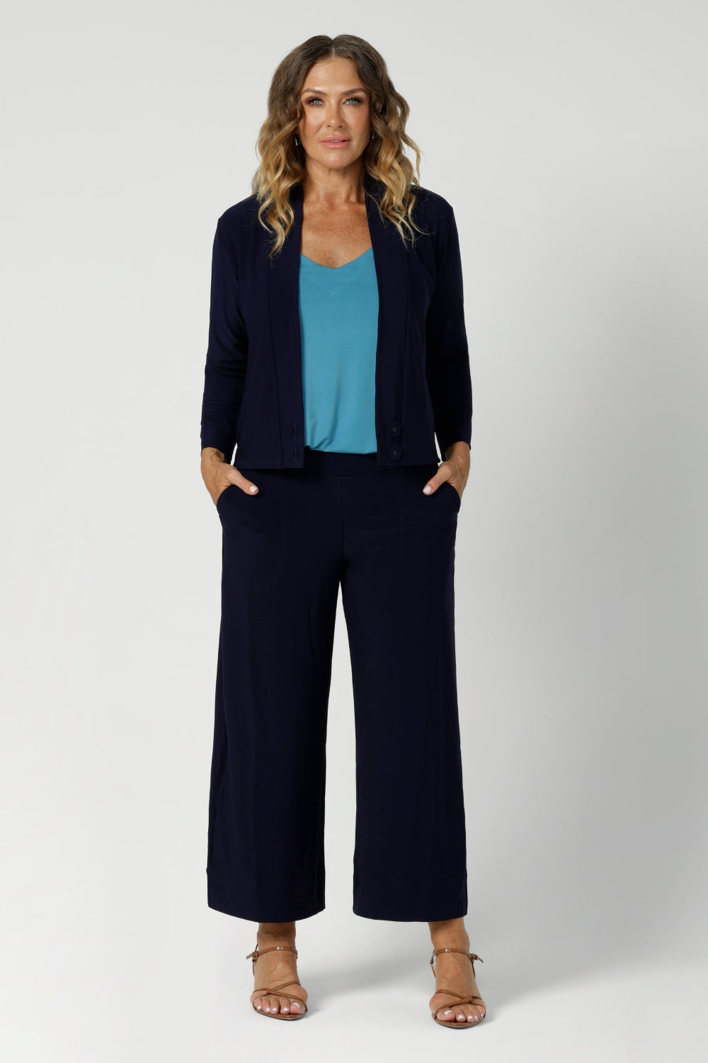 Size 12 Woman wearing the Eddy Cami in Mineral with wide straps. Styled back with the soft suiting set. Bradley Culotte in Navy & Sandro Jacardi in Navy. Made in Australia for women size 8 - 24. 