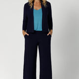 Size 12 Woman wearing the Eddy Cami in Mineral with wide straps. Styled back with the soft suiting set. Bradley Culotte in Navy & Sandro Jacardi in Navy. Made in Australia for women size 8 - 24. 