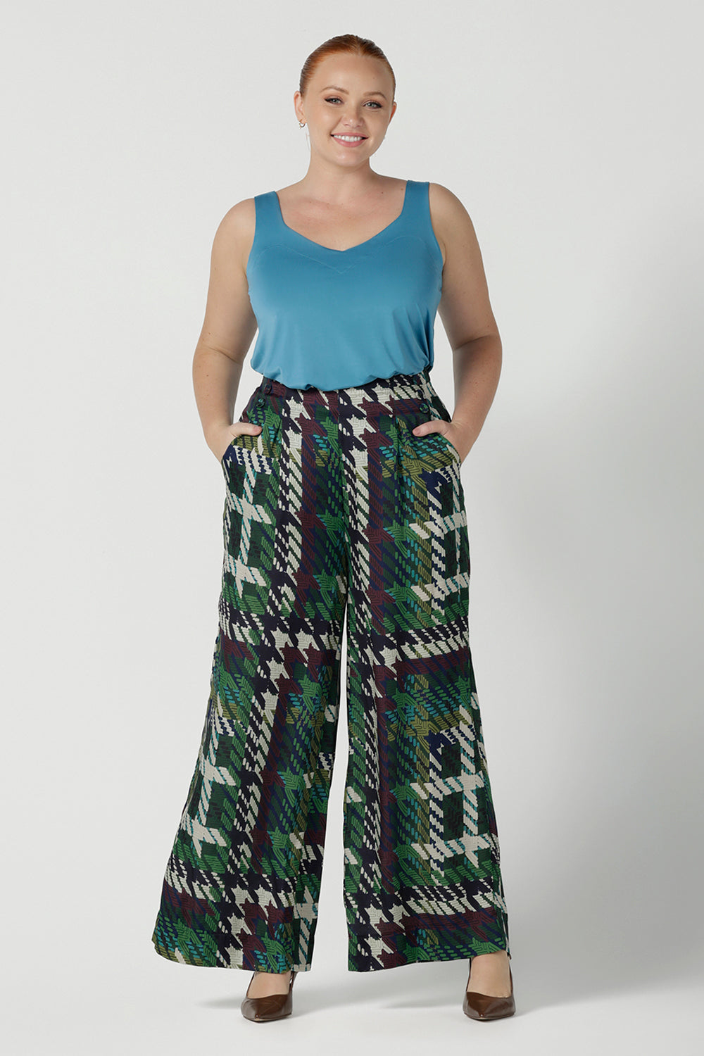 Size 12 Woman wears the Ellery Pant in Houndstooth.  A high waist pant with soft tailoring details. Wide straight leg with silky luxe italian viscose. Made in Australia for women size 8 - 24.