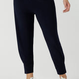 Close up of a size 10 woman wears a Navy Indi pant in jersey. A comfortable pant that is stylish and travel friendly. Made in Australia for women size 8-24. 