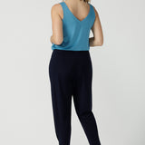 Back view of a size 10 woman wears a Navy Indi pant in jersey. A comfortable pant that is stylish and travel friendly. Made in Australia for women size 8-24. 