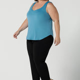 A size 18 woman wearing the Eddy Cami top in Mineral is a curve friendly cami top with wide shoulder straps for bra strap coverage. Made in Australia for women size 8 - 24.