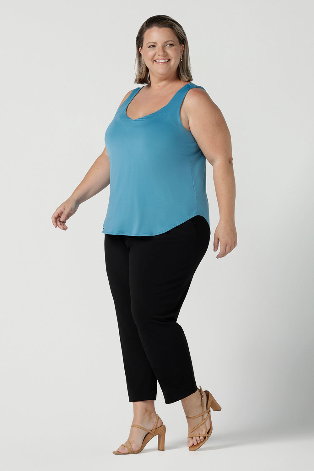 A size 18 woman wearing the Eddy Cami top in Mineral is a curve friendly cami top with wide shoulder straps for bra strap coverage. Made in Australia for women size 8 - 24.