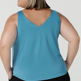 Back view of a size 18 woman wears the Eddy Cami top in Mineral is a curve friendly cami top with wide shoulder straps for bra strap coverage. Made in Australia for women size 8 - 24.