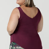 Back view of Amanda in s a size 18 in the Eddy Cami in plum. Made in Australia for women size 8 - 24. Styled back with the houndstooth Ellery pant. 