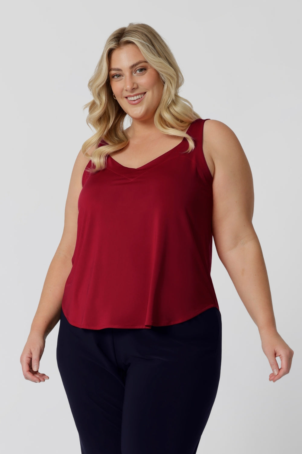 This lightweight red cami is the ideal addition to your summer wardrobe! Made from high-quality slinky jersey fabric, it offers a luxurious feel while being easy to care for. Its vibrant festive colour-way brings a cheerful touch, perfect for warmer months and all your summer celebrations. Proudly Australian made, this cami combines style and practicality, ensuring you stay cool and fashionable all season long. Dress it up or down for any occasion. Shop now in sizes 8-24.