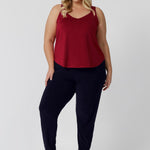 Plus sized woman wears red cami paired with travel friendly Indi Pant for a casual outfit. Made from high-quality slinky jersey fabric, it offers a luxurious feel while being an easy to care piece. This red cami is perfect for warmer weather to help cater to your summer celebrations. Proudly Australian made, this cami combines style and practicality, ensuring you stay cool and fashionable all season long. Leina & Fleur stock sizes 8-24.